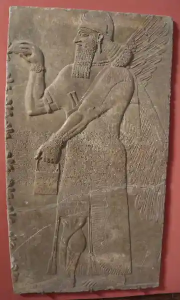 Relief slab from a wall, winged man - standing genie